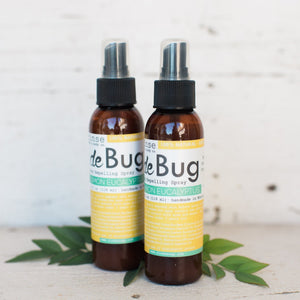 Two DeBug natural DEET-free bug repellent spray bottles by Rinse Bath & Body
