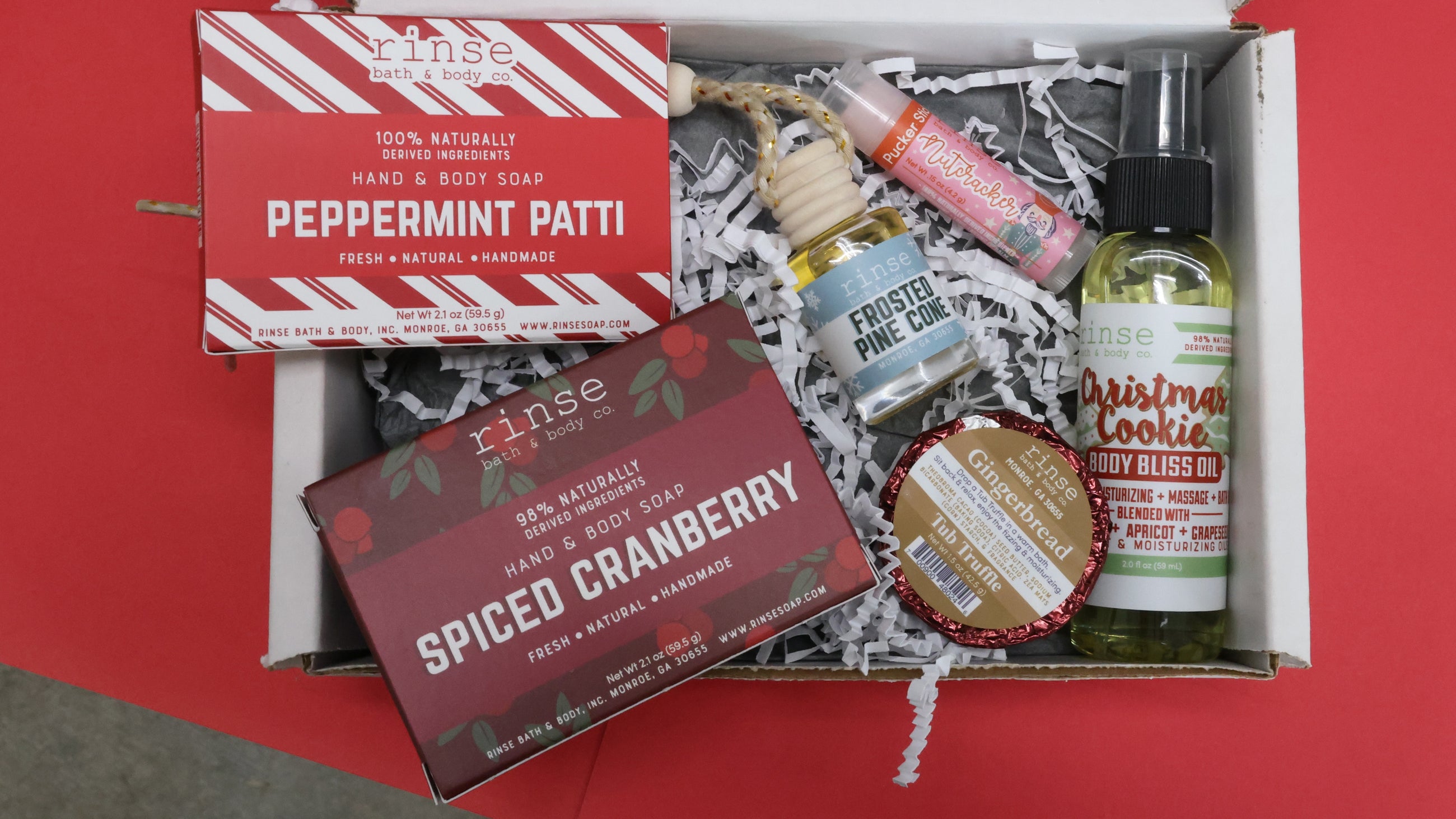 Rinse holiday stocking-stuffer gift box with peppermint and spiced cranberry minis