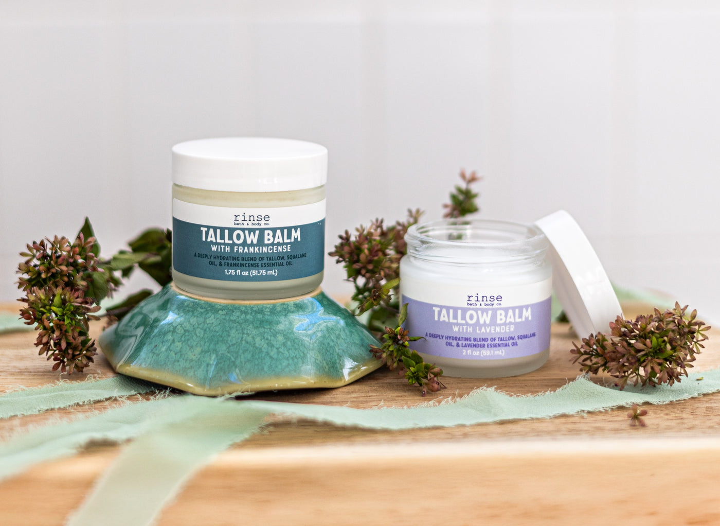 Rinse Tallow Balm with frankincense jars styled with botanicals on wood